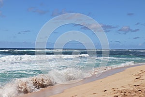 Beautiful blue ocean and sandy beach on the island of Oahu in Hawaii