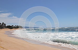 Beautiful blue ocean and sandy beach on the island of Oahu in Hawaii