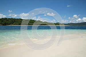 Beautiful blue ocean and white sand beach.