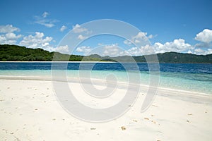 Beautiful blue ocean and white sand beach.