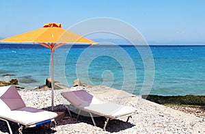 Beautiful blue sea and orange umbrella