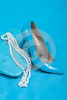 Beautiful blue shoes and handbag, pearls