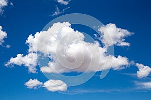 A beautiful blue sky with a big white cloud