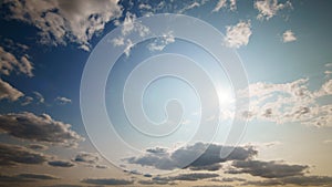 beautiful blue sky with dark dramatic cumulus clouds and sunlight for abstract background