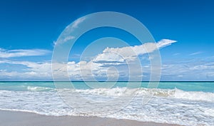 Beautiful blue sky holiday Varadero beach scene - getaway on a vacation beach in Cuba.