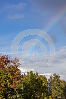 A beautiful blue sky with a rainbow in Finland.