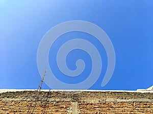 Beautiful blue sky and red brick expose