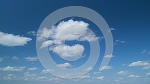 Beautiful blue sky with stratocumulus clouds background. Blue sky background with tiny cumulus clouds. Timelapse.