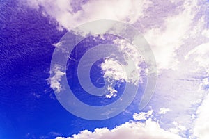 Beautiful blue sky on a summer day with white clouds and sun rays