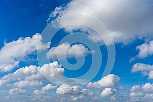 Beautiful blue sky with white cumulus clouds floating