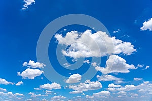 Beautiful blue sky with white cumulus clouds floating