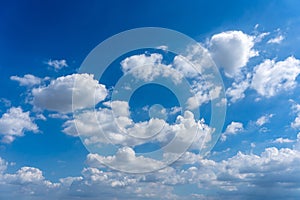 Beautiful blue sky with white cumulus clouds floating