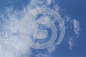 Beautiful blue sky with white fluffy clouds on a clear sunny day