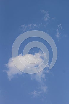 Beautiful blue sky with white fluffy clouds on a clear sunny day