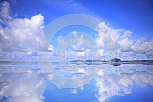 Beautiful blue sky and white fluffy clouds  Reflected on the water surface  Vibrant color sky with cloud on a sunny day and clouds