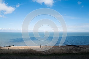 Beautiful blue tones in the sea and sky along the sea front in Tankerton, Whitstable. photo