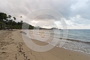 Beautiful blue violet sunset at la piscina beach inside colombian tayrona park