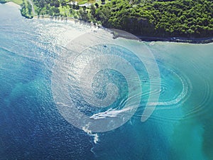 Beautiful blue water of coastal area with boat passing fast