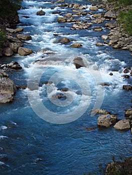 Beautiful blue water in the river in the green valle