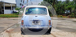 Beautiful Blue and White classic Mini cooper parked on the street