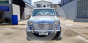 Beautiful Blue and White classic Mini cooper parked on the street or road