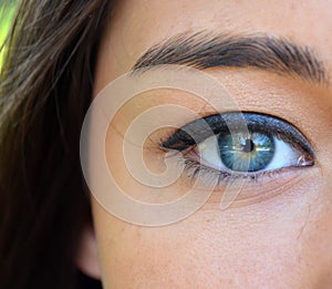 Beautiful blue woman eye closeup
