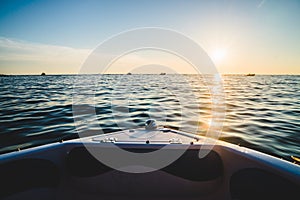 Beautiful boat ride, sunset seen from a motorboat in the Adriatic Sea. Relaxing peaceful moment on the waves