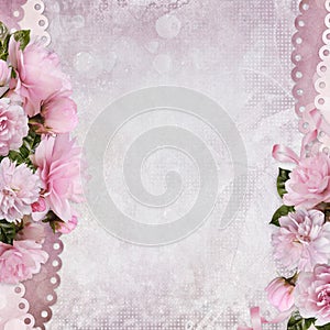 Beautiful borders of pink roses on a gentle romantic vintage background with space for text or photo