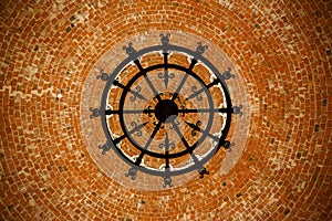 Beautiful bottom up view to the brick ceiling and antique chandelier