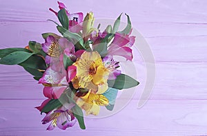 Beautiful bouquet of alstroemeria season on a wooden