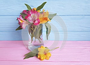 Beautiful bouquet of alstroemeria season on a wooden vase