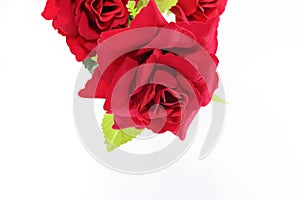 A beautiful bouquet of artificial red roses on white isolated with copy space background. Love and romance concept.