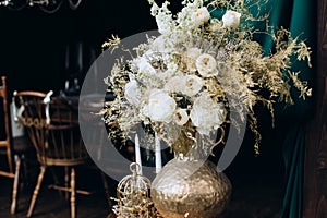 Beautiful bouquet in boho style with white flowers. Wedding decor