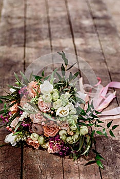 Beautiful bouquet of the bride on a wooden background