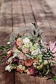 Beautiful bouquet of the bride on a wooden background