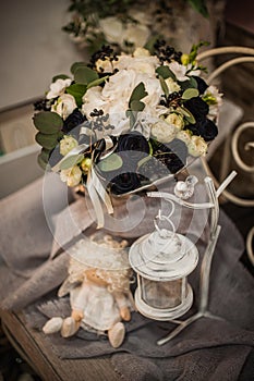 Beautiful bouquet of bright white rose and black decor