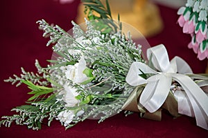 beautiful bouquet of bright white rose flowers, on table.Wedding flowers, bridal bouquet closeup.