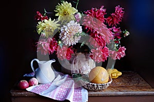 Beautiful bouquet of Dahlias in a vase on the table.