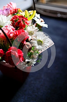 beautiful bouquet of different flowers close-up on a dark background