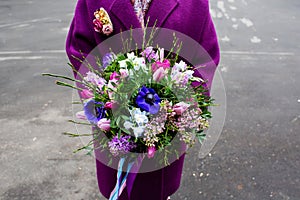 Beautiful bouquet in female hands photo