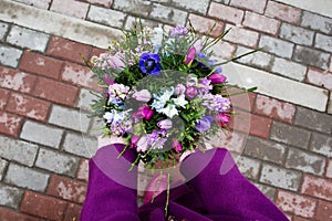 Beautiful bouquet in female hands photo