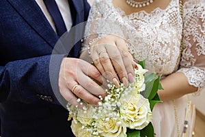 Beautiful bouquet of flowers in the hands of the bride