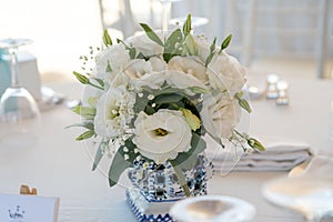 a beautiful bouquet of flowers used as a centerpiece at a wedding