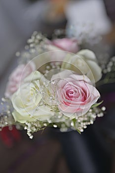 A Beautiful bouquet of flowers with white buds in black vase