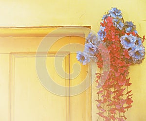 Beautiful Bouquet of Flowers by The Wooden Door with Soft Focus Color Filtered Background used as Template, Vintage Style