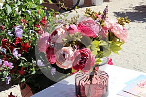 beautiful bouquet with pink flowers, roses on the street, decor for a restaurant