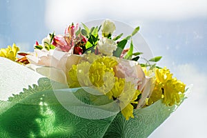 Beautiful bouquet with pink roses, yellow chrysanthemums and purple alstroemeria. Tender spring bouquet.