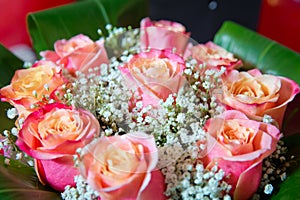 Beautiful bouquet of roses close-up . Pink and yellow mixed Rose, beautiful nature background . Artificial roses on table,Love