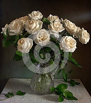 Beautiful bouquet of roses in a crystal jug.