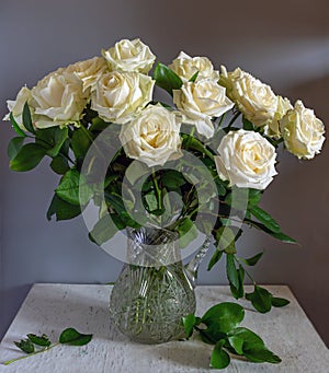 Beautiful bouquet of roses in a crystal jug.